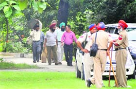 Government employees take election material to their respective centres from Government College for Women, Ludhiana, on Saturday