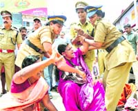 Janadipathya Mahila Association members being arrested during an agitation against hike in petrol prices in Kozhikode on Saturday. 