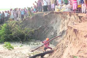 The bundh-strengthening work at the Dhusi bundh in progress at Baopur village in Shahkot on Saturday