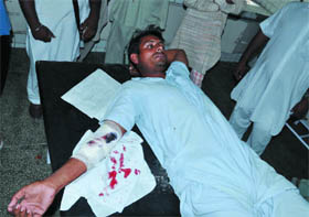 Charanjit Singh Charna (centre), who sustained a bullet injury during a scuffle outside the polling booth in Karaiwala village near Giddarbaha, undergoes treatment at the Civil Hospital in Malout