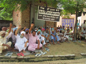 Residents of Mandi Khurd protest against the upcoming garbage dumping yard in the village on Sunday. 