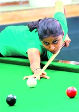 A player in action during a snooker meet in Chandigarh on Sunday.