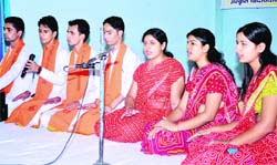 Students sing a song in Haridwar on Sunday. 
