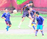 Players of Army School, Clementown (in blue), and Doon Valley Public School (in black) in action in a match in the Ram Bahadur Chhetri Memorial Football Tournament in Dehradun on Sunday