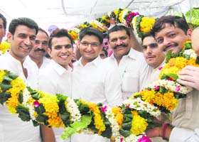 DUSU president Ajay Chikkara, MP Deepender Hooda and MLA Rajinder Singh Joon at a felicitation function in Kanonda village of Jhajjar district on Sunday