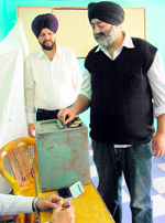 A voter casts his ballot during the SGPC elections in Shimla on Sunday