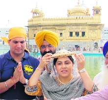 British Cabinet minister Sayeeda Warsi pays obeisance at the Golden Temple in Amritsar on Sunday. 