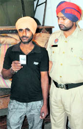 Manpreet Singh, with shorn hair, being detained at the ITI College in Ludhiana. 