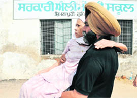 Pritam Kaur (85), a resident of Shimlapuri, comes out of a polling centre after casting her vote in Ludhiana on Sunday