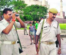 Security men patrol near the Taj Mahal on Sunday. Security has been beefed up following Saturday's blast in the city