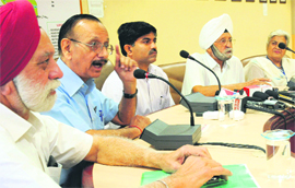 DIG Alok Kumar and senior citizens address a joint press conference at the police headquarters in Chandigarh on Monday.