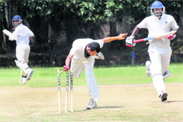 Bowler Mansoor Ali Khan makes an effort to run out Awana during the JP Atray Memorial Tournament at St Johns School in Chandigarh on Monday