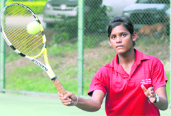 A player plays a shot during the CLTA-AITA Super Series Tennis Tournament in Chandigarh on Monday. 