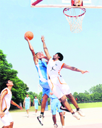 A basketball match in progress during the All-India Public School Conference Sports Meet being held at YPS School, Mohali, on Monday. A total of 48 schools are participating in the six-day tourney. 