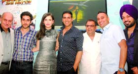 (L to R) Anupam Kher, Vinay Virmani, Camilla Belle, Akshay Kumar, Ajay Virmani, Russell Peters and Gurpreet Gughi, actors and makers of movie 'Speedy Singhs', at a press conference to promote their film in New Delhi on Monday.