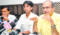 Members of Team Anna (from right) Prashant Bhushan, Kumar Vishwas and Arvind Kejriwal meet mediapersons in Dehradun