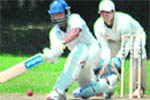 A batsman plays a shot during a cricket match of the All-India JP Atray Memorial Cricket Tournament in Chandigarh