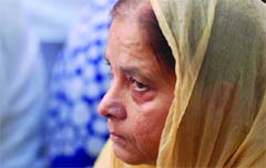 A family member of one of the Delhi High Court blast victims at the all-religious prayer meeting organised for the departed souls in New Delhi on Monday. 