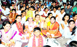 Students from Sanskrit school wait for their turn at the final day of the Sanskrit schools cultural competition at Saraswati Vidya Mandir, Mayapur, in Haridwar on Tuesday. 