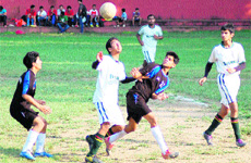 Players of Col Brown (in white) and Doon International School (in black) in action in a match in the Ram Bahadur Chhetri Memorial Football Tournament in Dehradun