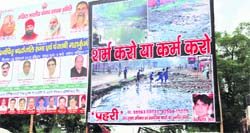 A hoarding, installed at an important crossing in Sirsa town, shows poor sanitation in the town. 