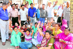 Members of the Jagti Tenement Committee protest against the lack of basic amenities at Jagti Camp in Jammu