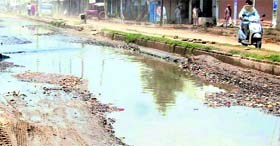 Commuters are forced to ply on this muddy, uneven road due to delay in development works at Jagraon.