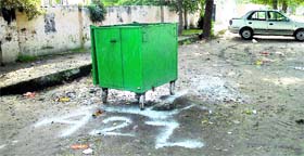 Staff of A2Z company cleaned garbage bins in Ludhiana on Tuesday.