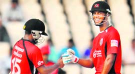T&Ts Adrian Barath (L) celebrates the win with Lendl Simmons in Hyderabad on Tuesday.