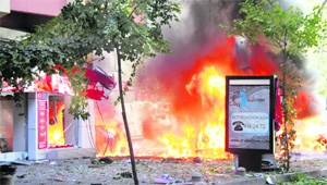 Fire rages in a street after a blast in central Ankara on Tuesday. 