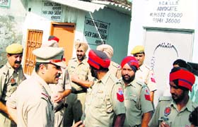 A team of police officials at the scene of crime