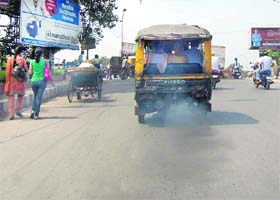 Polluting autos such as this are a menace on the city roads