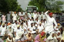 Residents of Buttar Shrin village block traffic in protest against denial of repolling in their village, on the Muktsar-Bathinda road on Wednesday.