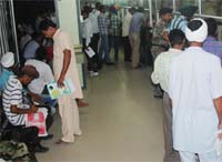 Visitors waiting for their turn at the Suvidha Centre in Bathinda on Wednesday.