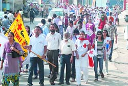 Students of SSD Girls College carry out a march celebrating the Red Cross Day in Bathinda on Wednesday.