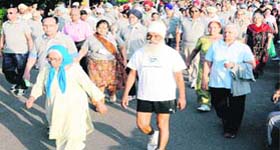 Ninetyfive-year-old Mann Kaur (leading), accompanied by her 72-year-old son Gurvinder Singh, takes part in the “Run for Fun” organised by the Chandigarh Police at Sukhna Lake in Chandigarh on Wednesday morning