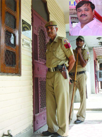 Policemen outside the residence of Sonu Sachdev (inset) who was murdered early in the morning in west Delhi on Wednesday. 
