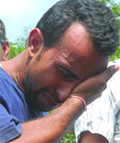 Parvesh, who was arrested for extortion, breaks down as he is produced before the media at the PHQ in New Delhi on Wednesday. 