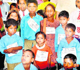 Children whose temporary houses in the Lalji Wala area were removed during an anti-encroachment drive stage a protest at the City Magistrates office in Haridwar on Wednesday