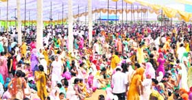 A large gathering of devotees at Raipur Rasulpur village
