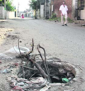An open manhole on Devi Talab Hospital road in Jalandhar