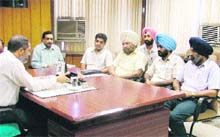 Officiating Mayor Parveen Bansal chairs a meeting with MC and railway officials in Ludhiana on Wednesday. 