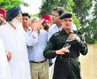 Chief Minister Parkash Singh Badal at a flood-hit village in Fazilka district. 