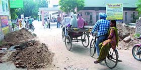 The dug-up road leading from the entrance of the Civil Hospital to the OPD block, which is causing inconvenience to the patients.