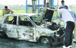 The police investigates the Alto car at Adrash Nagar in New Delhi 