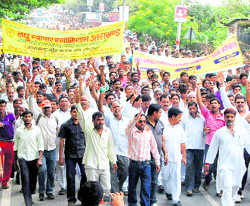 Street vendors hold a march in Dehradun on Thursday