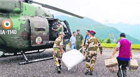 Army personnel load goods for air-dropping in quake-hit areas in Gangtok on Thursday.