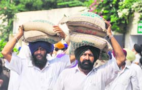 Farmers walk away with their share of the seed
