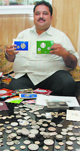 Harish Kumar Goyal shows his rich collection of postage stamps. 