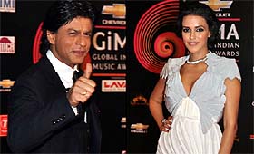 Bollywood actors Shah Rukh Khan and Neha Dhupia at the second Chevrolet Global Indian Music Awards function in Gurgaon.